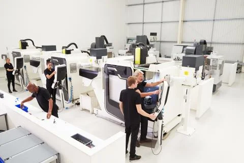 High Angle View Of Engineering Workshop With CNC Machines Stock Photos