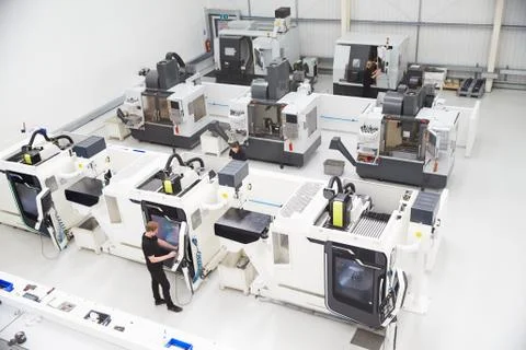 High Angle View Of Engineering Workshop With CNC Machines Stock Photos
