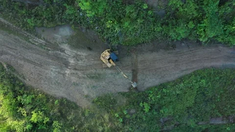 High angle view of an excavator that is working on the road and removing some Stock Footage 142761054