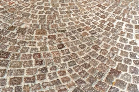 High angle view of fan shaped cobblestone pattern in reddish granite with white Stock Photos