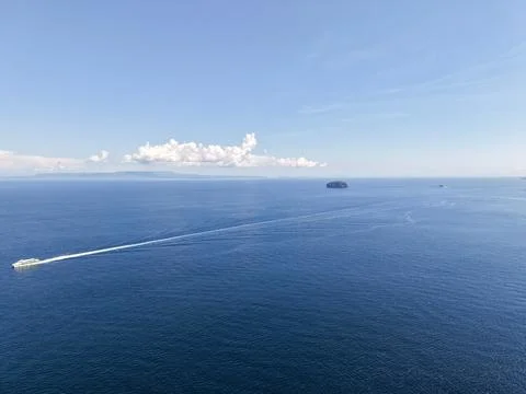 High Angle View of Fast Ferry Boat Cruising on Deep Blue Tropical Sea Stock Photos