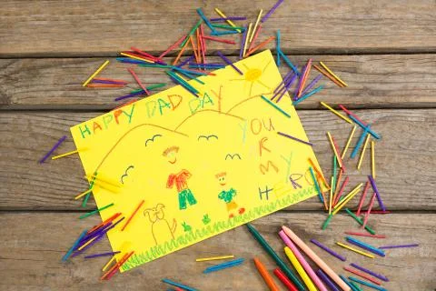 High angle view of fathers day greeting card with crayons Stock Photos