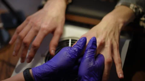 High angle view female hands in gloves massaging male palms in slow motion Stock Footage 249698258