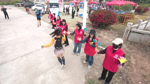 High angle view of female runner doing high-5 with the crowd Stock Footage 303871145