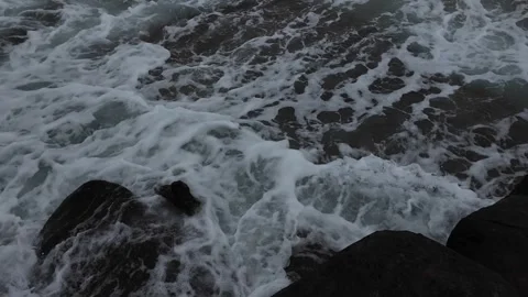 High angle view of foamy ocean waves in Kauai Hawaii Stockbeeldmateriaal 348731490