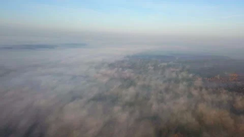 High angle view on a foggy forest. 4k aerial. Stock Footage 154327064