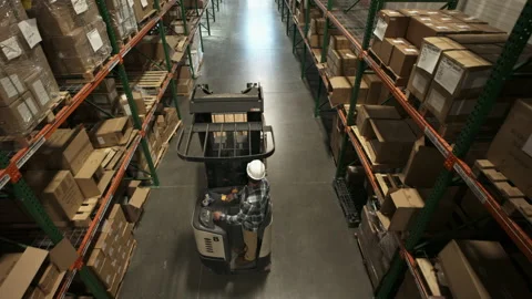 High angle view following forklift driver in warehouse / American Fork, Utah, Stock-Footage 275542241