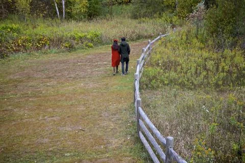 High angle view of the footpath in autumn with rear view of a couple Stock Photos