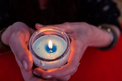 High angle view of fortune teller woman holding candle Stock-Fotos