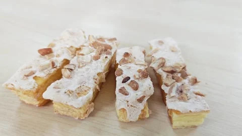 High-angle view of four French Jésuite pastries in a row. Stock Footage 347633025
