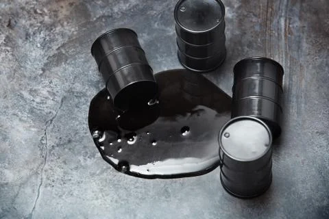 High angle view on four fuel barrels with spilled oil Stock Photos