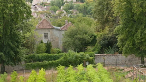 High Angle View Framed by Trees Overlooking Rural Village Houses in Provins Vídeo Stock 340636070