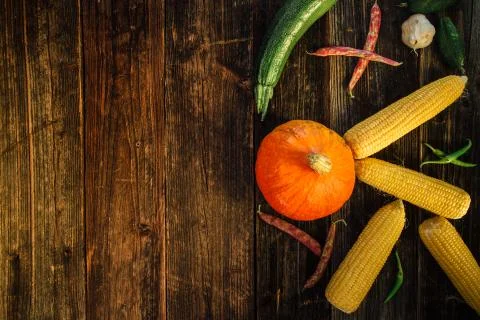 High angle view of fresh vegetables on wooden table with copy space Stock Photos