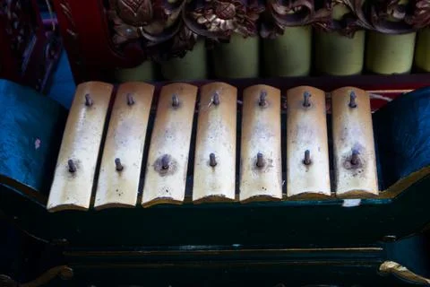 High Angle View of Gamelan Saron Instrument Keys Mounted on Carved Wooden F.. Stock Photos