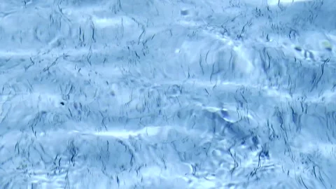 High angle view of gentle large rippling beautiful blue swimming pool water Stock Footage 256625454