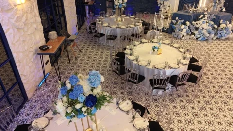 High-angle view of grand, ornate dining space with multiple round tables Stockbeeldmateriaal 336218433