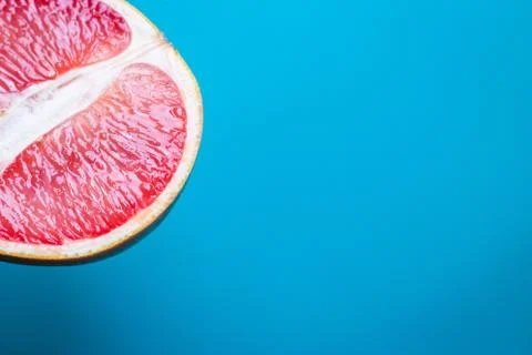 High angle view of grapefruit on a blue background in a studio Stock Photos