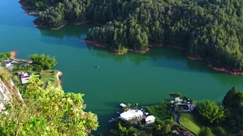 High Angle View of Green Lake Waters and Shoreline in Guatape Colombia 스톡 동영상 345045009