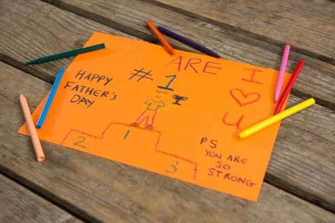 High angle view of greeting card with crayons Stock Photos