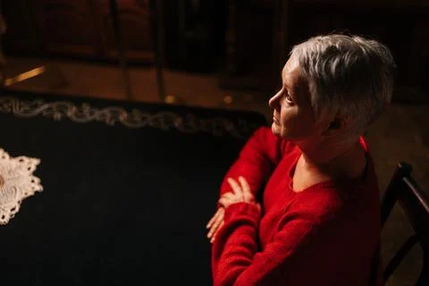 High-angle view of grey-haired mature adult woman receiving forecasting future Stock Photos