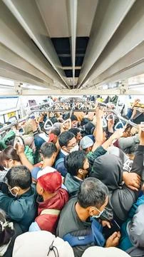 High angle view. Group of adults standing close together inside the train Stock Photos