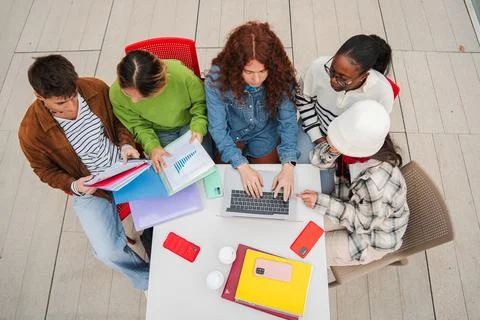 High angle view of a group of multiracial students doing the highschool homework Stock Photos