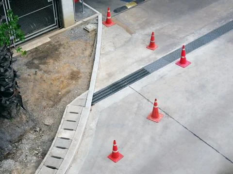 High Angle View of Group of Orange Plastic Road Cones Foto stock
