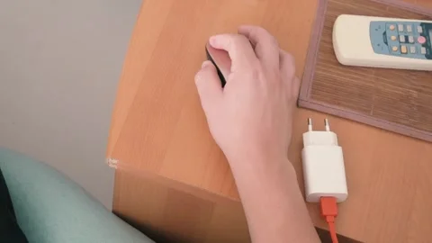 High Angle View of Hand Using Wireless Computer Mouse on Wooden Desk Stock Footage 343378702