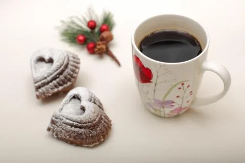 High angle view of heart shape  cookies with a mug of hot coffee, and twig of Stock Photos