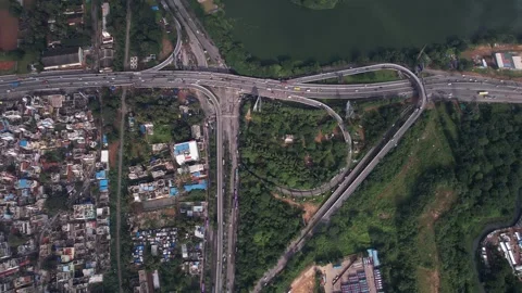High angle view of Hebbal Flyover and lake surrounded by greenery in Bengal.. Stock Footage 339560119