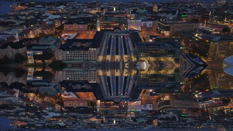 High angle view of Helsinki train station. Tilt up reveal of night cityscape Video stock 254070881