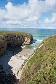 High angle view of hidden beach surrounded by steep cliffs Stock Photos