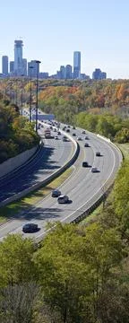 High angle view of the highway traffic in autumn with the downtown skyline Stock Photos