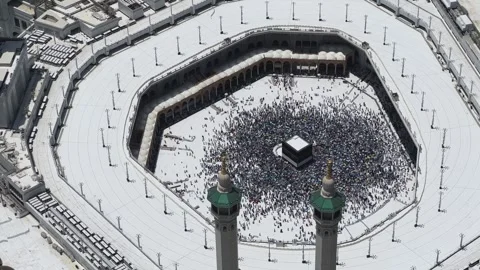 High-angle view of Holy Kaaba in Mecca surrounded by thousands of pilgrims Stock Footage 340195042