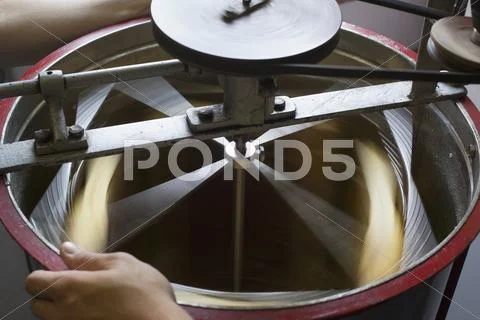High Angle View Of Honey Being Separated In Machinery At Industry