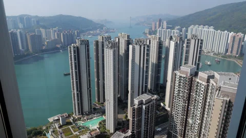 High angle view of Hong Kong high-rise apartments surrounding waterfront Stockbeeldmateriaal 341004475
