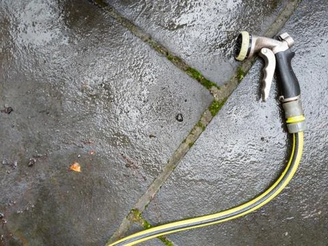 High angle view of hose nozzle on patio Foto stock