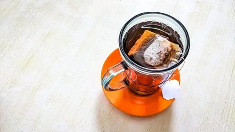 High angle view. A hot drink in the form of a tea bag in a glass. Stock Photos