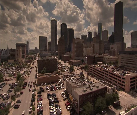 High angle view of Houston skyline and parking lots with pan Stock Footage 86697597