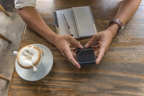 High angle view of human hand using phone Stock Photos