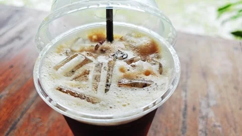 High angle view of iced coffee on wooden table. Stock Footage 341865666