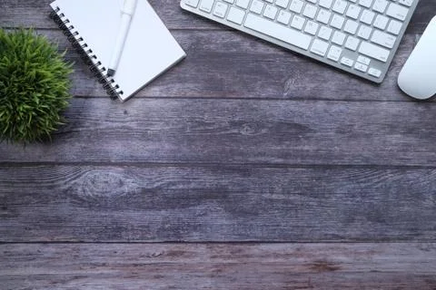 High angle view of keyboard, notepad with copy space on table Stock Photos