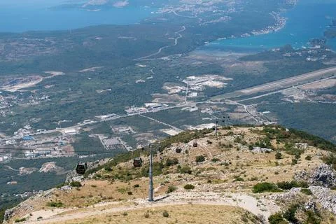 High-angle view of the Kotor Cable Car ascending the rugged mountain slopes Stock Photos