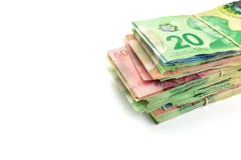 High Angle View of Large Stack of Canadian Banknotes on a White Background Stock Photos