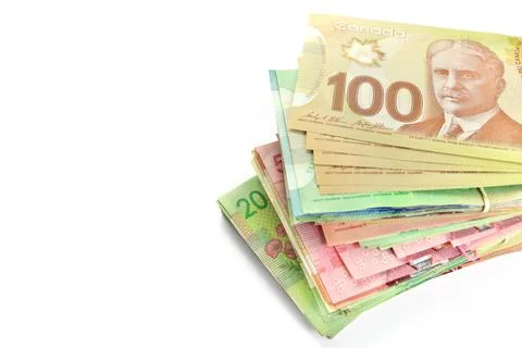 High Angle View of Large Stack of Canadian Banknotes on a White Background Stock Photos