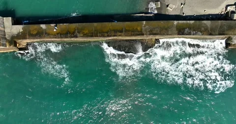 High Angle View With Lighthouse, Rocks And Sea Stock Footage 227922921