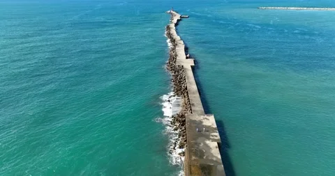 High Angle View With Lighthouse, Rocks And Sea Stock Footage 227923007