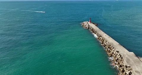 High Angle View With Lighthouse, Rocks And Sea Stock Footage 227923101
