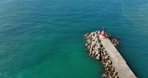 High Angle View With Lighthouse, Rocks And Sea Stock Footage 227923395