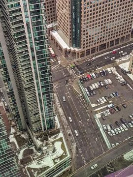 High Angle View Looking Down at a Snowy Downtown Street Between Skyscrapers Stock Photos